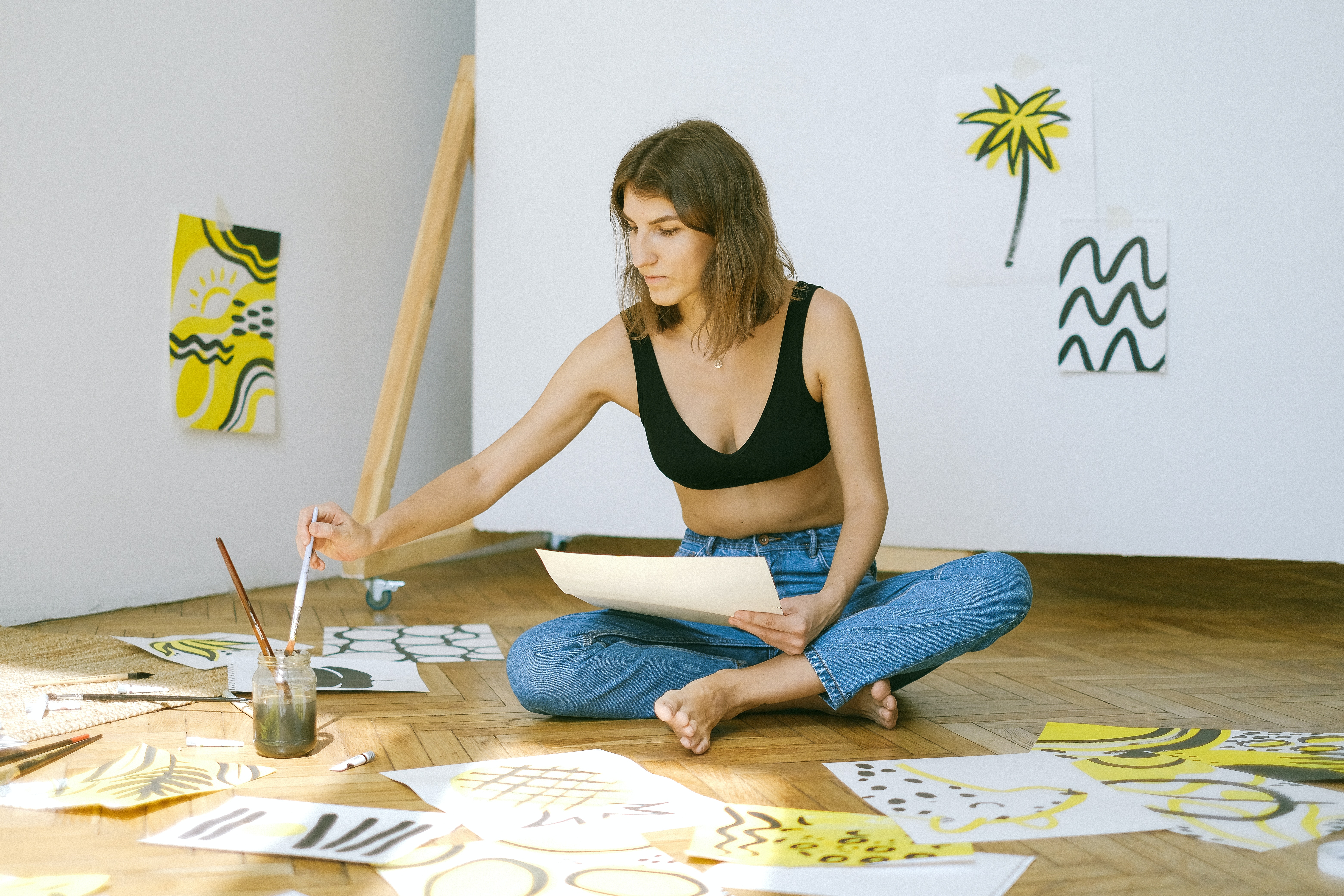 photo-of-woman-sitting-on-floor-while-painting-4483167